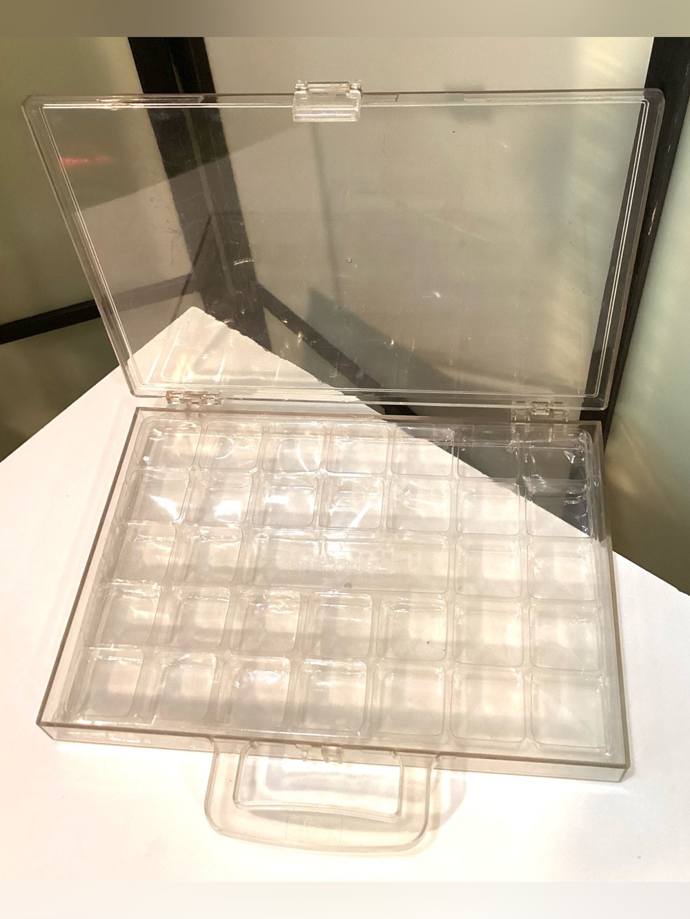 2 acrylic/plastic organizers, one with handle. For Jewelry or small items.